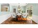 Staged dining room featuring decorative wainscoting and chandelier at 5035 Foxberry Ln, Roswell, GA 30075
