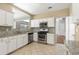 Traditional kitchen features granite countertops and stainless steel appliances at 5035 Foxberry Ln, Roswell, GA 30075