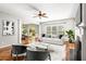 Elegantly furnished living room with fireplace and open layout, seamlessly connecting to the adjacent dining area at 5035 Foxberry Ln, Roswell, GA 30075