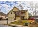 Charming two-story home with a welcoming facade, well-manicured lawn, and a spacious two-car garage at 963 Ensign Peak Ct, Lawrenceville, GA 30044
