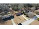 Aerial view showcasing the house, driveway, and surrounding neighborhood at 11 Grove Ln, Hampton, GA 30228
