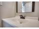 Close-up of a clean, well-maintained bathroom sink with bronze fixtures and a bright white countertop at 11 Grove Ln, Hampton, GA 30228