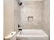 Elegant bathroom with tiled walls, updated shower head, and a convenient built-in niche at 11 Grove Ln, Hampton, GA 30228