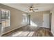 Spacious bedroom featuring new flooring and two bright windows with plenty of natural light at 11 Grove Ln, Hampton, GA 30228