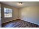 Bedroom featuring carpet, a large window, and neutral paint at 11 Grove Ln, Hampton, GA 30228