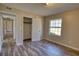 Bedroom with hardwood flooring, neutral walls and a window at 11 Grove Ln, Hampton, GA 30228