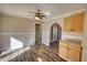 Dining room featuring hardwood floors, neutral paint, ceiling fan, and kitchen access at 11 Grove Ln, Hampton, GA 30228