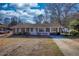 Welcoming brick house with a charming white picket fence, enhancing its curb appeal and homey feel at 11 Grove Ln, Hampton, GA 30228