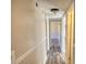 Hallway featuring hard wood floors and neutral paint at 11 Grove Ln, Hampton, GA 30228
