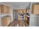 Updated kitchen featuring stainless steel appliances, ample cabinet space, and new flooring at 11 Grove Ln, Hampton, GA 30228