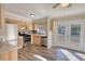 Renovated eat-in kitchen with stainless steel appliances, stone backsplash and french doors at 11 Grove Ln, Hampton, GA 30228