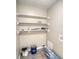Functional laundry room features shelving for storage and ample space at 11 Grove Ln, Hampton, GA 30228
