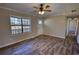Bright living room featuring modern flooring and access to the entry door and hallway at 11 Grove Ln, Hampton, GA 30228