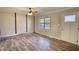 Living room featuring hard wood floors, neutral paint, and natural lighting at 11 Grove Ln, Hampton, GA 30228