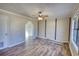 Living room featuring hard wood floors and neutral paint at 11 Grove Ln, Hampton, GA 30228