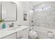 Clean bathroom featuring a bathtub and shower with a marble tiled wall at 2010 Barnes Mill Rd, Marietta, GA 30062