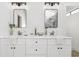 Modern bathroom with dual vanities, sleek mirrors, and stylish fixtures at 2010 Barnes Mill Rd, Marietta, GA 30062