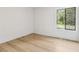 Bright bedroom with neutral walls, wood flooring and natural light from window at 2010 Barnes Mill Rd, Marietta, GA 30062