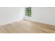 Light filled bedroom featuring a large window and light-colored wood flooring at 2010 Barnes Mill Rd, Marietta, GA 30062