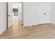 Bedroom with neutral walls, wood flooring and access to an outdoor deck at 2010 Barnes Mill Rd, Marietta, GA 30062