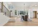 Bright dining room with sleek wood floors and a staircase, open to the kitchen at 2010 Barnes Mill Rd, Marietta, GA 30062