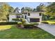 Well-maintained two-story home with manicured landscaping, gray garage door, and inviting curb appeal at 2010 Barnes Mill Rd, Marietta, GA 30062