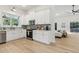 Modern kitchen boasts stainless steel appliances, quartz countertops, and hardwood floors at 2010 Barnes Mill Rd, Marietta, GA 30062