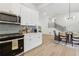 Spacious kitchen and dining area features stainless appliances and backyard views at 2010 Barnes Mill Rd, Marietta, GA 30062