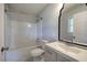 The remodeled bathroom includes a new vanity, toilet, tub with tile surround, and modern fixtures at 2122 Browntown Rd, Rockmart, GA 30153