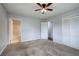 A clean bedroom with a door to the bathroom and a closet with white doors at 2122 Browntown Rd, Rockmart, GA 30153
