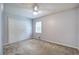 A bedroom with closet and light fan with carpet floors and natural light at 2122 Browntown Rd, Rockmart, GA 30153