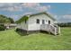 Single-story home features a grassy front yard and a porch for outdoor enjoyment at 2122 Browntown Rd, Rockmart, GA 30153