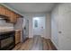 Functional kitchen with wooden cabinets, laminate countertops, stainless steel fridge, and modern appliances at 2122 Browntown Rd, Rockmart, GA 30153