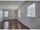 The living room features hardwood floors, large windows, and a new light fixture at 2122 Browntown Rd, Rockmart, GA 30153