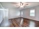 Bright, airy living room with hardwood floors, neutral walls, ceiling fan, and plenty of natural light at 2122 Browntown Rd, Rockmart, GA 30153
