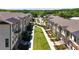 An aerial view of modern townhomes with landscaped pathways and green spaces, showcasing community living at 340 Olmstead Way # 34, Alpharetta, GA 30022