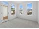Bedroom with light carpet, plenty of natural light, and private outdoor access at 340 Olmstead Way # 34, Alpharetta, GA 30022