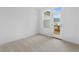 Bedroom with light carpet and private access to the outdoor deck at 340 Olmstead Way # 34, Alpharetta, GA 30022