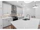 Modern kitchen featuring white cabinets, stainless steel appliances, quartz countertops, and pendant lighting at 340 Olmstead Way # 34, Alpharetta, GA 30022