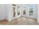 Light-filled living room featuring a door and windows that offer a view of the outdoors at 340 Olmstead Way # 34, Alpharetta, GA 30022