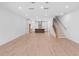 Open-concept living space with a kitchen and staircase, perfect for entertaining at 340 Olmstead Way # 34, Alpharetta, GA 30022
