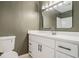 Updated bathroom featuring a bright white vanity, modern fixtures and lighting, and a neutral color palette at 5400 Louis Xiv Ln, Atlanta, GA 30349