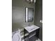 Nicely decorated bathroom with modern vanity and a gray accent wall at 5400 Louis Xiv Ln, Atlanta, GA 30349