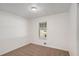 Bedroom with neutral carpet and one window at 5400 Louis Xiv Ln, Atlanta, GA 30349