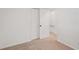 Bedroom with carpet, closet, and view to the hallway at 5400 Louis Xiv Ln, Atlanta, GA 30349