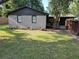 Charming single-story home with a well-maintained front yard, mature tree, and a covered carport at 5400 Louis Xiv Ln, Atlanta, GA 30349