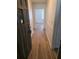 Inviting foyer with wood flooring and entry to a naturally lit bedroom at 5400 Louis Xiv Ln, Atlanta, GA 30349