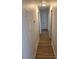 Hallway showing the attractive flooring leading to other rooms of the house at 5400 Louis Xiv Ln, Atlanta, GA 30349