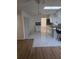 Bright kitchen with white cabinets, contrasting backsplash, and a skylight at 5400 Louis Xiv Ln, Atlanta, GA 30349