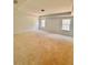 A spacious bedroom featuring tray ceilings and natural light from well-placed windows at 7216 Eton Ln, Locust Grove, GA 30248